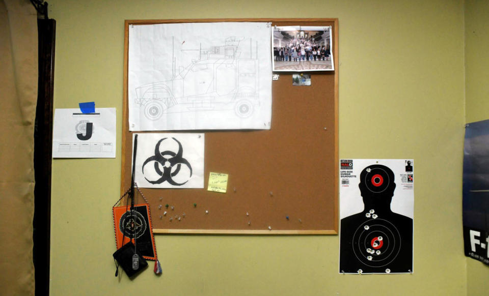 This image contained in Justice Department motion for continued pretrial detention of Jack Teixeira, shows his room at his father's home in North Dighton, Mass. A judge has put off a decision on whether the Massachusetts Air National guardsman accused of leaking highly classified military documents should be held in jail until his trial. Prosecutors said Teixeira kept an arsenal of weapons and said on social media that he would like to kill a "ton of people." (Justice Department via AP)