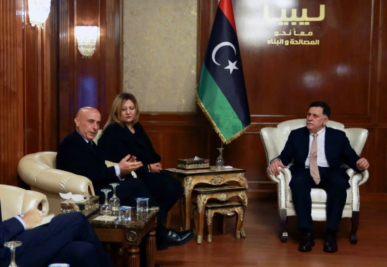 Libyan Prime Minister Fayez al-Sarraj holds talks with Italian Interior Minister Marco Minniti in Tripoli on December 9, 2017, on ways of battling people smugglers