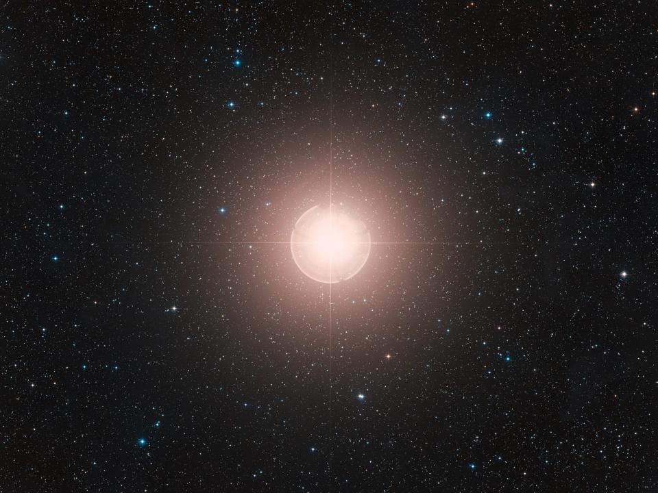 A picture of Betelgeuse taken from earth shows it shining bright against other stars in the firmament.