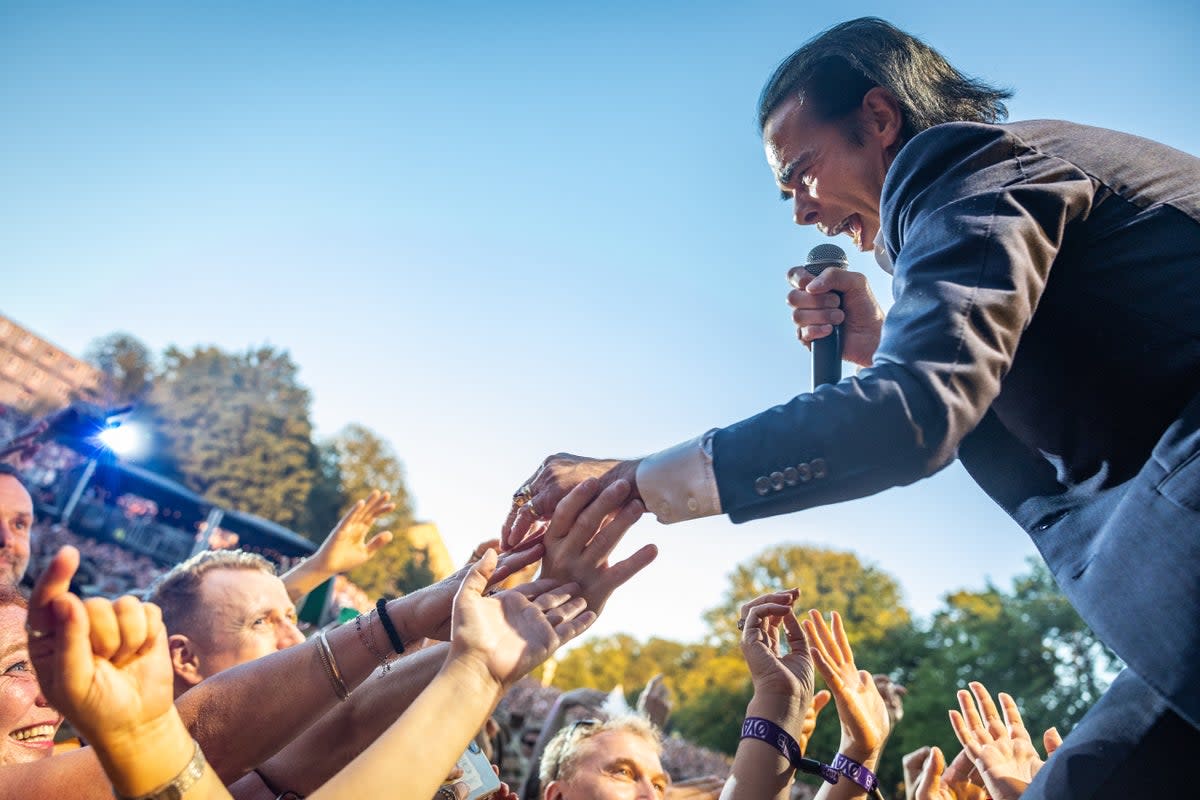 Nick Cave reaches out to the crowd at Øya 2022 (Redferns)