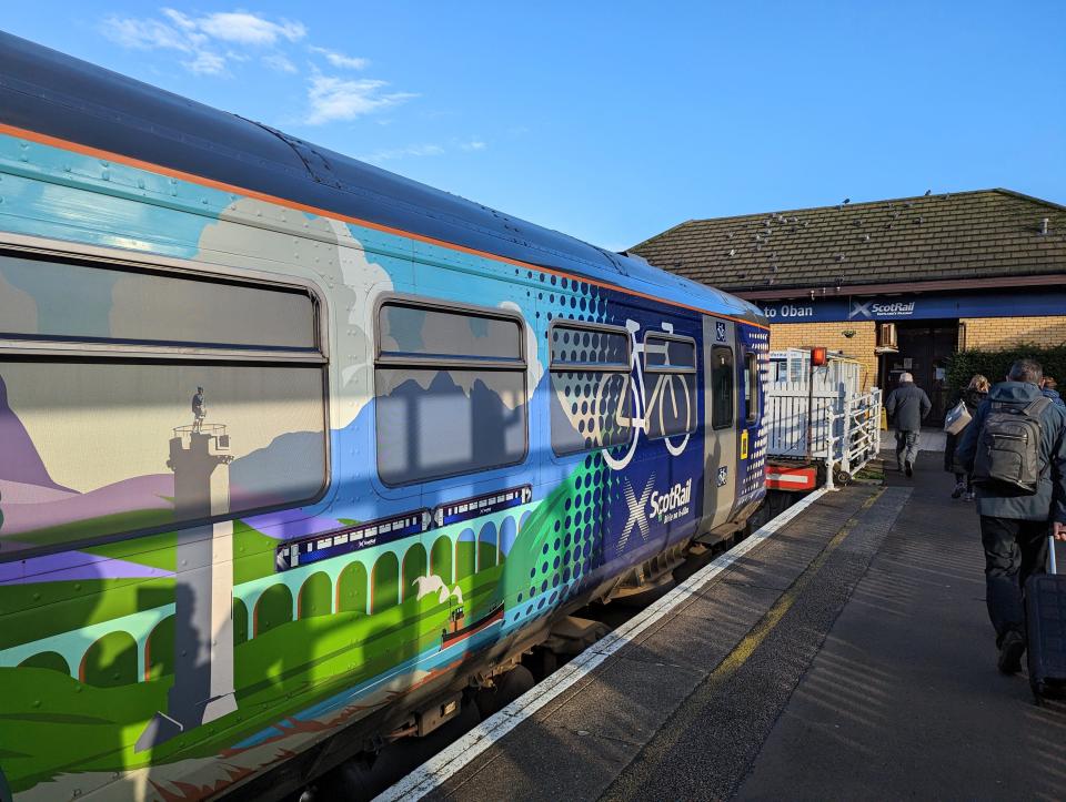 exterior of ScotRail train, painted green and blue