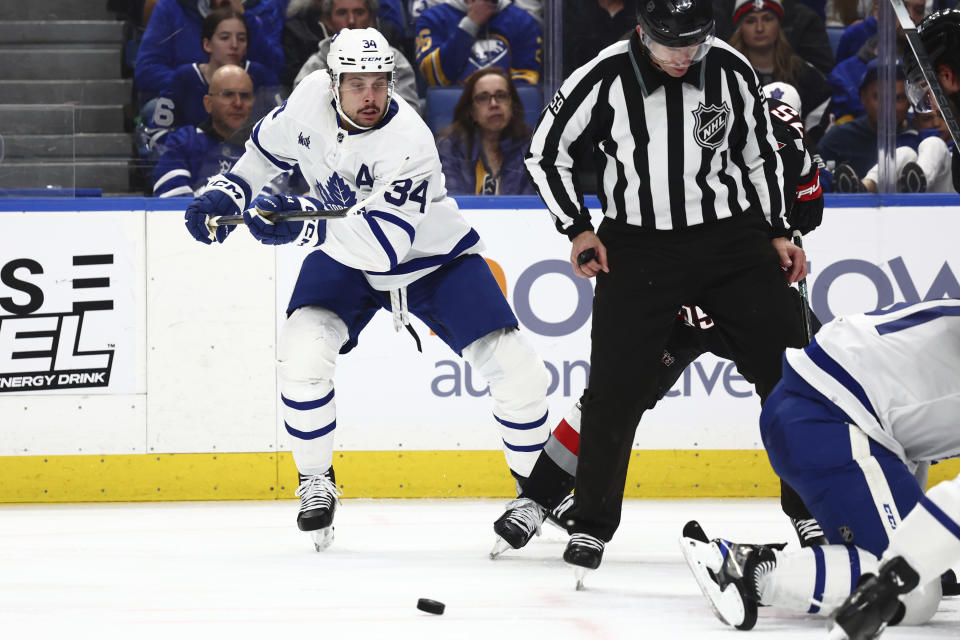 Toronto Maple Leafs center Auston Matthews (34) skates toward a loose puck during the second period of an NHL hockey game against the Buffalo Sabres, Saturday, March 30, 2024, in Buffalo, N.Y. (AP Photo/Jeffrey T. Barnes)