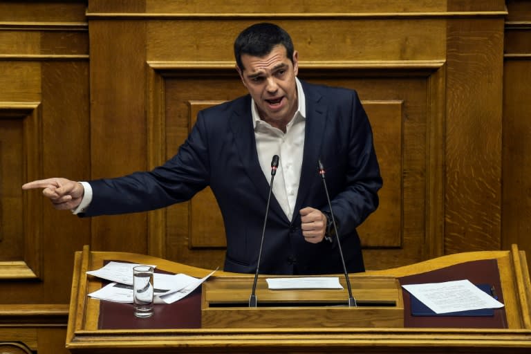 Greece's Prime Minister Alexis Tsipras speaks during a parliamentary debate prior to a vote on his demand to n investigate whether nearly a dozen senior politicians received bribes from, or helped promote, Swiss pharmaceutical giant Novartis