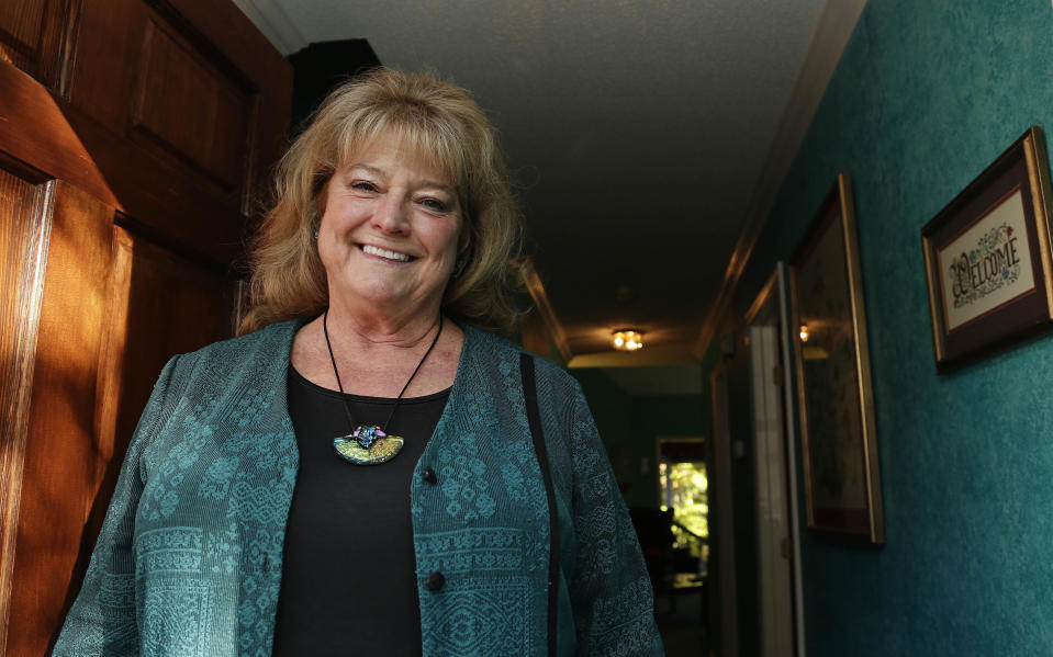In this photo taken Friday, Nov. 16, 2018 Melinda Wilkinson, a Democratic voter and retired music teacher is seen at her home in Raleigh, N.C. Republicans "have gerrymandered the heck out of lots of different places," said Wilkinson. She added: "It seems very unfair." (AP Photo/Gerry Broome)