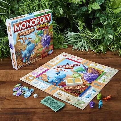 Monoply junior dinosaur board game on a table