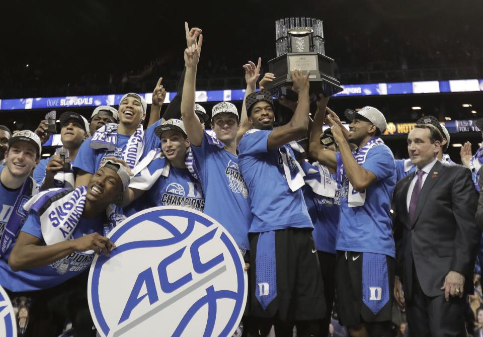 Duke players hold up the championship trophy after beating Notre Dame 75-69 in an NCAA college basketball game during the championship game of the Atlantic Coast Conference tournament, Saturday, March 11, 2017, in New York. (AP Photo/Julie Jacobson)