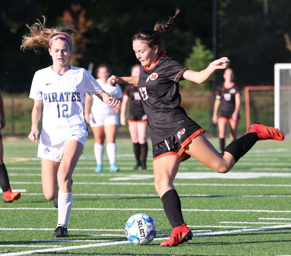 Middleboro's Leah Stearns passes the ball in front of Hull's Maeve White during a game on Thursday, Oct. 06, 2022. 
