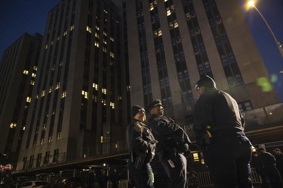 Police officers stand outside Manhattan Criminal Court in New York, Thursday, March. 30, 2023. Donald Trump has been indicted by a Manhattan grand jury, prosecutors and defense lawyers said Thursday, making him the first former U.S. president to face a criminal charge and jolting his bid to retake the White House next year. (AP Photo/Yuki Iwamura)