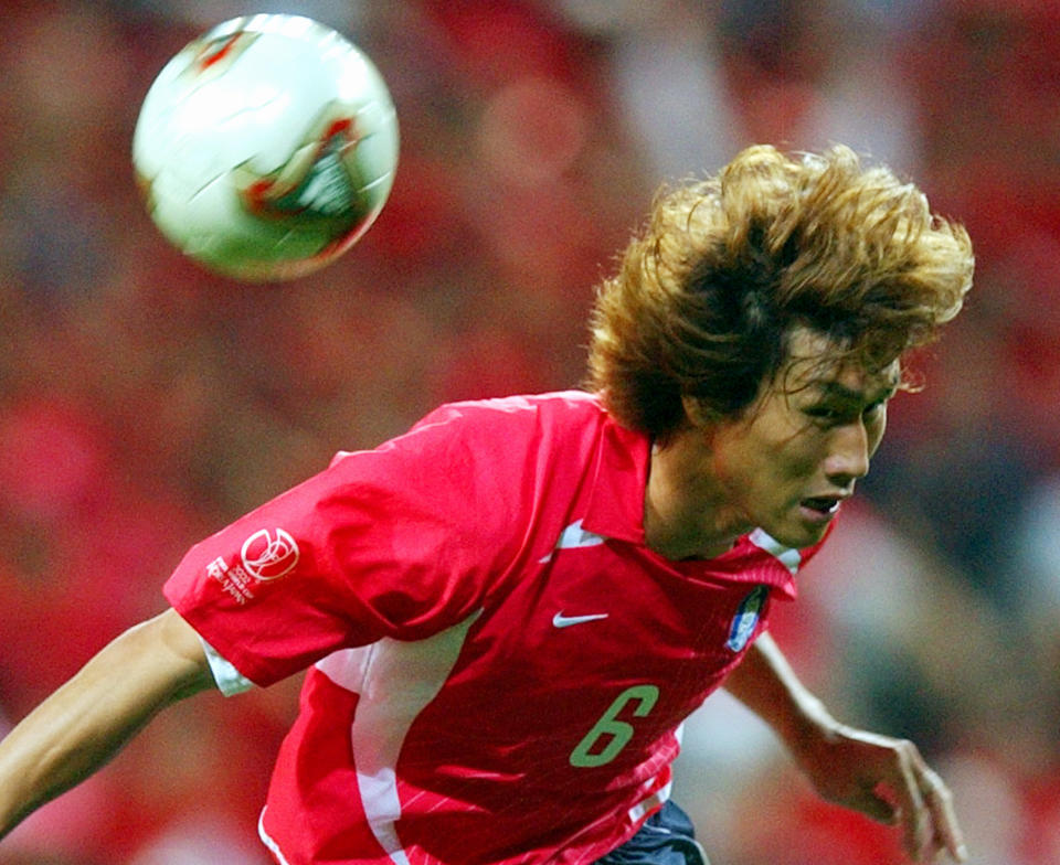 FILE - In this June 25, 2002, file photo, South Korea's Yoo Sang-chul jumps for an header, during the 2002 World Cup semifinal match between Germany and South Korea, at the Seoul World Cup stadium in Seoul, South Korea,. Yoo, one of the stars of South Korea’s surprising run to the semifinals at the 2002 World Cup, has died after long battle with pancreatic cancer. He was 49. (AP Photo/Luca Bruno, File)