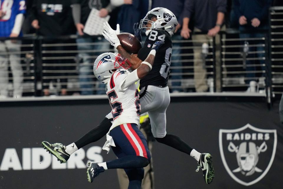 Mandatory Credit: Photo by John Locher/AP/Shutterstock (13672976eb) Las Vegas Raiders wide receiver Keelan Cole (84) catches a 30-yard touchdown pass against New England Patriots cornerback Marcus Jones (25) during the second half of an NFL football game between the New England Patriots and Las Vegas Raiders, in Las Vegas Patriots Raiders Football, Las Vegas, United States - 18 Dec 2022