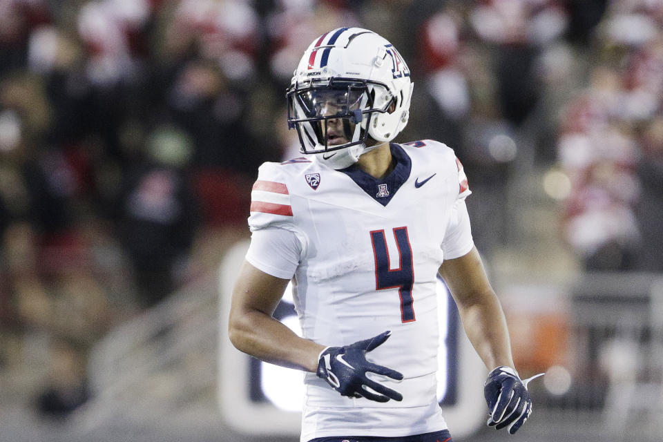 FILE - Arizona wide receiver Tetairoa McMillan lines up for a play during the second half of an NCAA college football game against Washington State, Saturday, Oct. 14, 2023, in Pullman, Wash. Arizona can make a lasting impression before leaving the Pac-12 to join the Big 12 next season. The Wildcats — two seasons removed from winning one game — face traditional power Oklahoma in the Alamo Bowl. (AP Photo/Young Kwak, File)