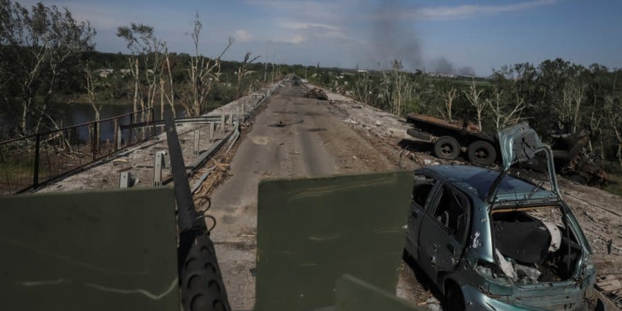 Ukrainian troops, including members of the International Legion, travel by road in the combat zone near Severodonetsk, Luhansk Oblast.