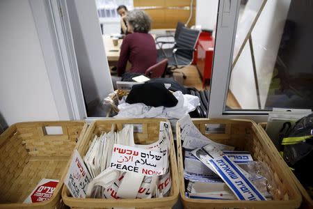 Employees of Peace Now, an Israeli NGO that tracks and opposes Jewish settlement in the occupied West Bank and East Jerusalem, work at their offices in Tel Aviv January 31, 2016.REUTERS/Baz Ratner