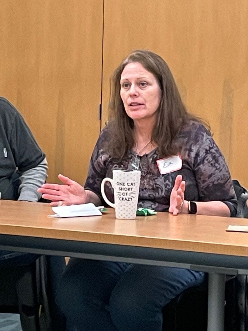 Eve Weatherholt of Temperance gives her thoughts on a book during an I Love A Mystery Book Club meeting.