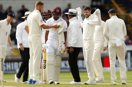 Cricket - England vs West Indies - Second Test - Leeds, Britain - August 29, 2017 England's James Anderson and West Indies' Kieran Powell talk Action Images via Reuters/Lee Smith