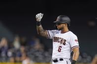 Arizona Diamondbacks' David Peralta celebrates his double against the Miami Marlins during the fifth inning of a baseball game Monday, May 10, 2021, in Phoenix. (AP Photo/Ross D. Franklin)