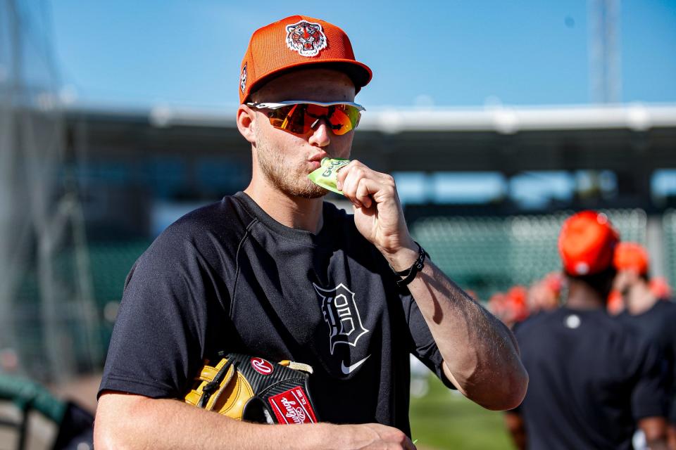 Detroit Tigers outfielder Parker Meadows eats applesauce before practice during spring training at Joker Marchant Stadium in Lakeland, Florida, on Thursday, Feb. 22, 2024.