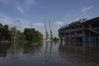 Streets are flooded in Kherson, Ukraine, Tuesday, Jun 6, 2023 after the walls of the Kakhovka dam collapsed overnight. The wall of a major dam in a part of southern Ukraine has collapsed, triggering floods, endangering Europe's largest nuclear power plant and threatening drinking water supplies. (AP Photo/Evgeniy Maloletka)