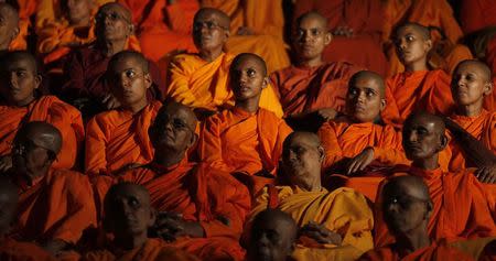 Monks from Buddhist organization Bodu Bala Sena (Buddhist Power Force, BBS) listen to a speech by Ashin Wirathu at a BBS convention in Colombo, September 28, 2014. REUTERS/Dinuka Liyanawatte