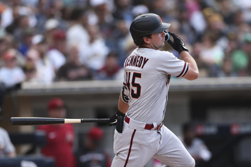 Arizona Diamondbacks' Buddy Kennedy watches his RBI triple against the San Diego Padres during the fourth inning of a baseball game Saturday, July 16, 2022, in San Diego. (AP Photo/Derrick Tuskan)