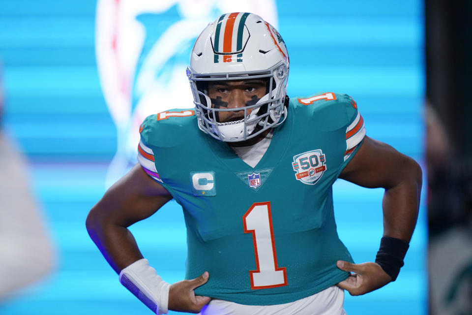 Miami Dolphins quarterback Tua Tagovailoa (1) enter the field before an NFL football game against the Pittsburgh Steelers, Sunday, Oct. 23, 2022, in Miami Gardens, Fla. (AP Photo/Wilfredo Lee )