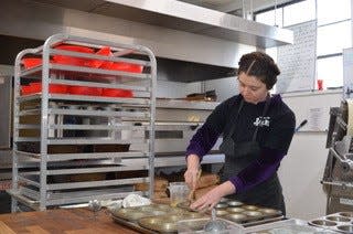 Rachel Aaron, a baker at Farmhouse Bakery in Etna, prepares tins to bake kouign-amann (pronounced 'queen a-mahn'), a flaky pastry similar to a croissant, with abundant butter and sugar, on Jan. 27, 2024.