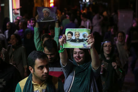 Supporters of Iranian president Hassan Rouhani celebrate his victory in the presidential election in Tehran, Iran, May 20, 2017. TIMA via REUTERS