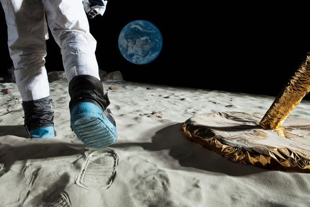 <p>Getty</p> An astronaut walks on the surface of the moon.