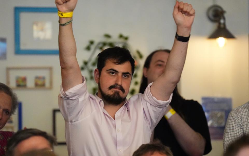 Liberal Democrat supporters celebrate at an election results watch party at the London Art Bar, central London, as party leader Sir Ed Davey wins his seat at the 2024 General Election come in after polls close.