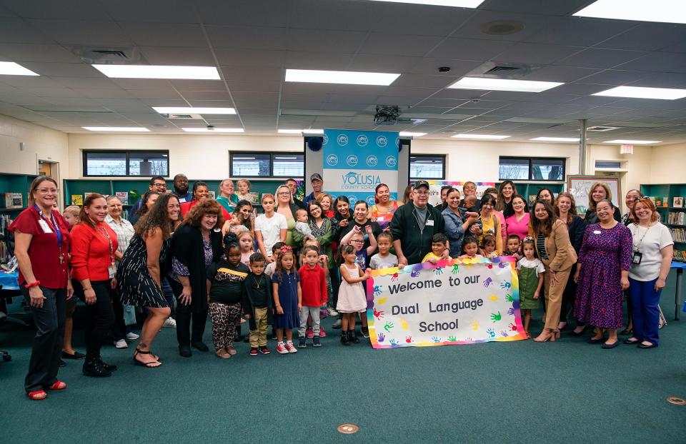 Parents, students and staff during a ribbon-cutting ceremony for the Dual Spanish-English Language Program at Discovery Elementary in Deltona, Friday, Nov. 17, 2023.