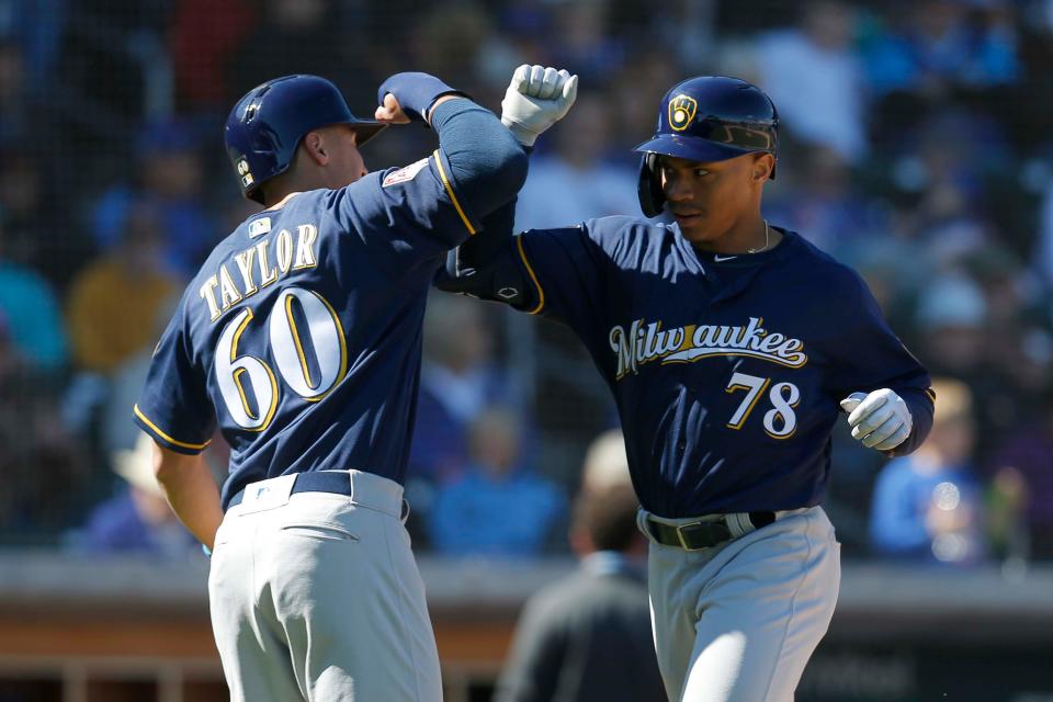 Milwaukee Brewers center fielder Corey Ray celebrates with Tyrone Taylor after Ray homered in a spring training game in 2019.