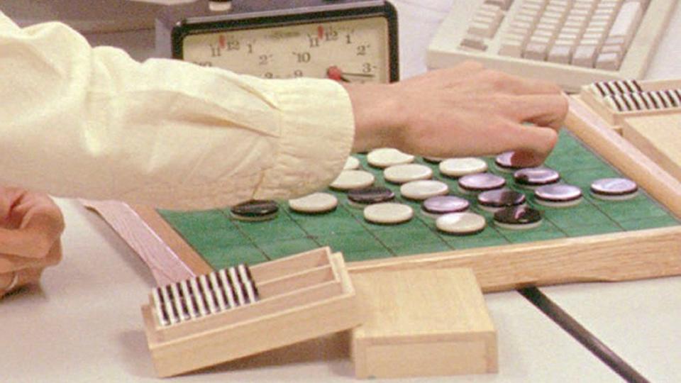 Mandatory Credit: Photo by Daniel Hulshizer/AP/Shutterstock (6038113a)Takeshi Murakami, the world Othello champion from Tokyo, makes a move during his first game against a computer at the NEC Research Institute Inc.