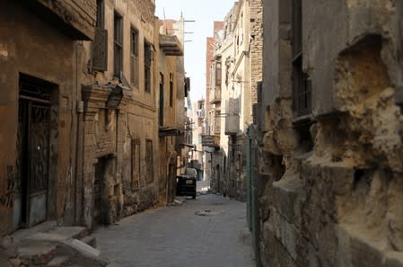 Alleyway and old buildings are seen in the Darb al-Labbana hillside neighbourhood in Cairo