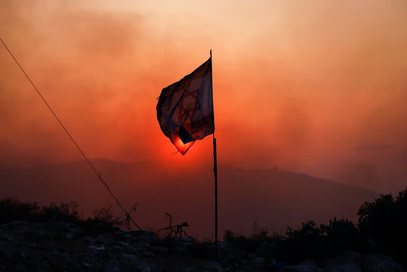 Lasers and bonfires light up battle over new Israeli settlement