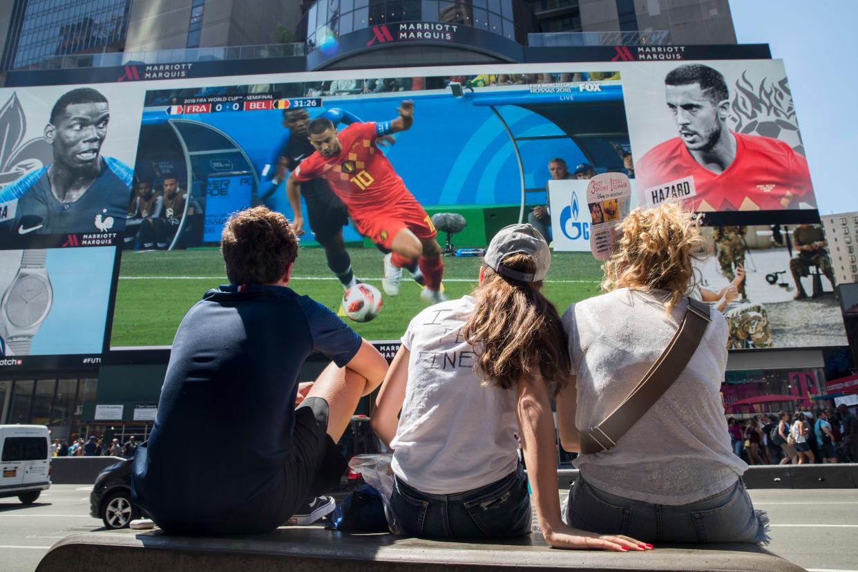 FILE - Soccer fans watch France play Belgium in a World Cup semifinal soccer game on a gigantic screen in New York's Times Square, on July 10, 2018, in New York. 