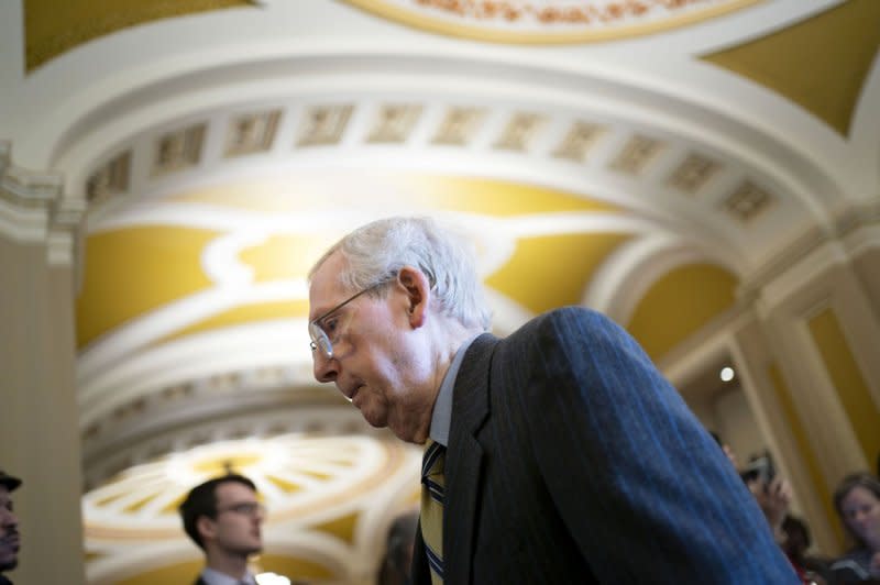 Senate Minority Leader Mitch McConnell, R-Ky., walks to the Senate Chambers before a vote on the bipartisan immigration and border security legislation on Wednesday. Photo by Bonnie Cash/UPI