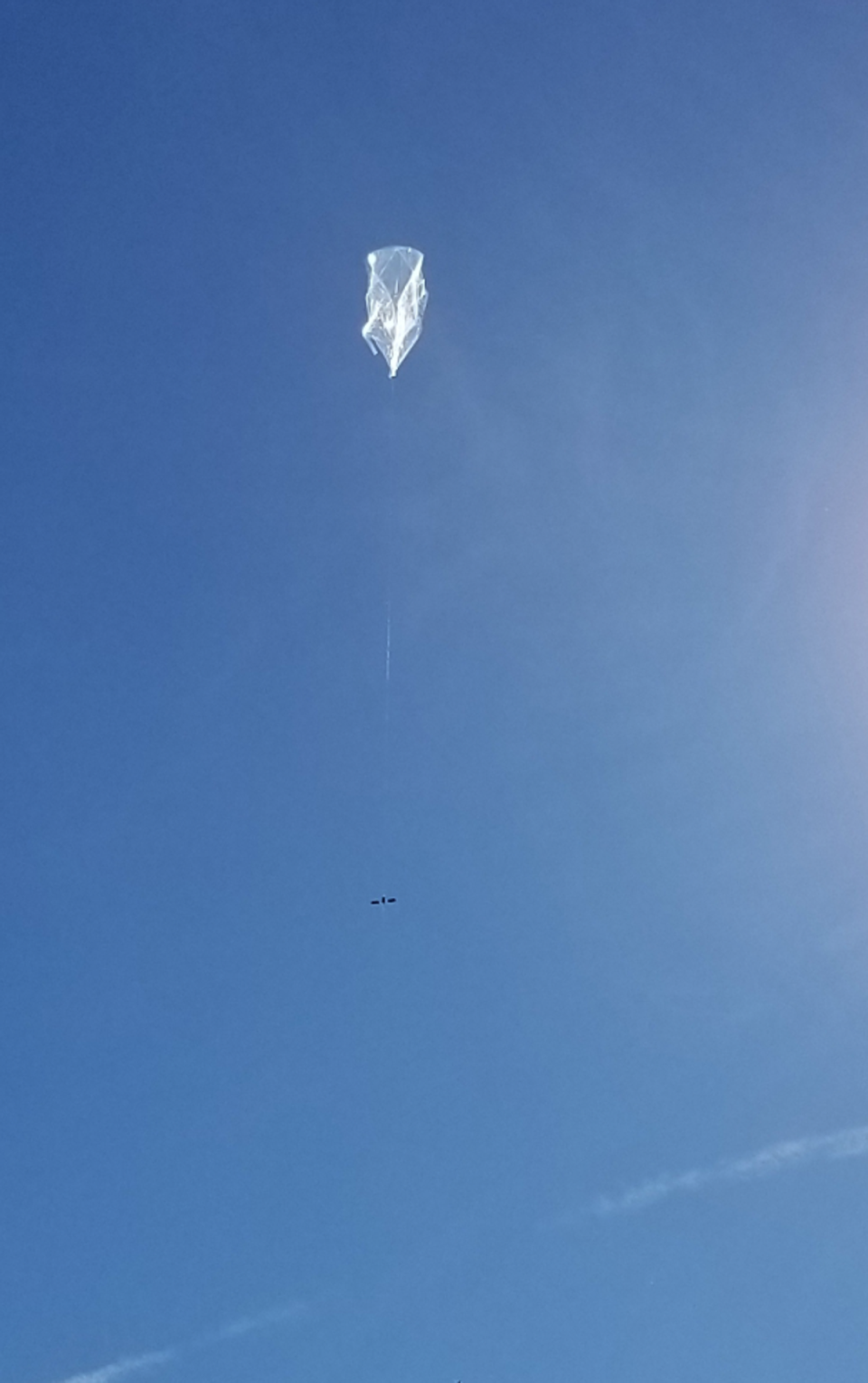 A balloon carrying a solar-powered transmitter (California Near Space Project)