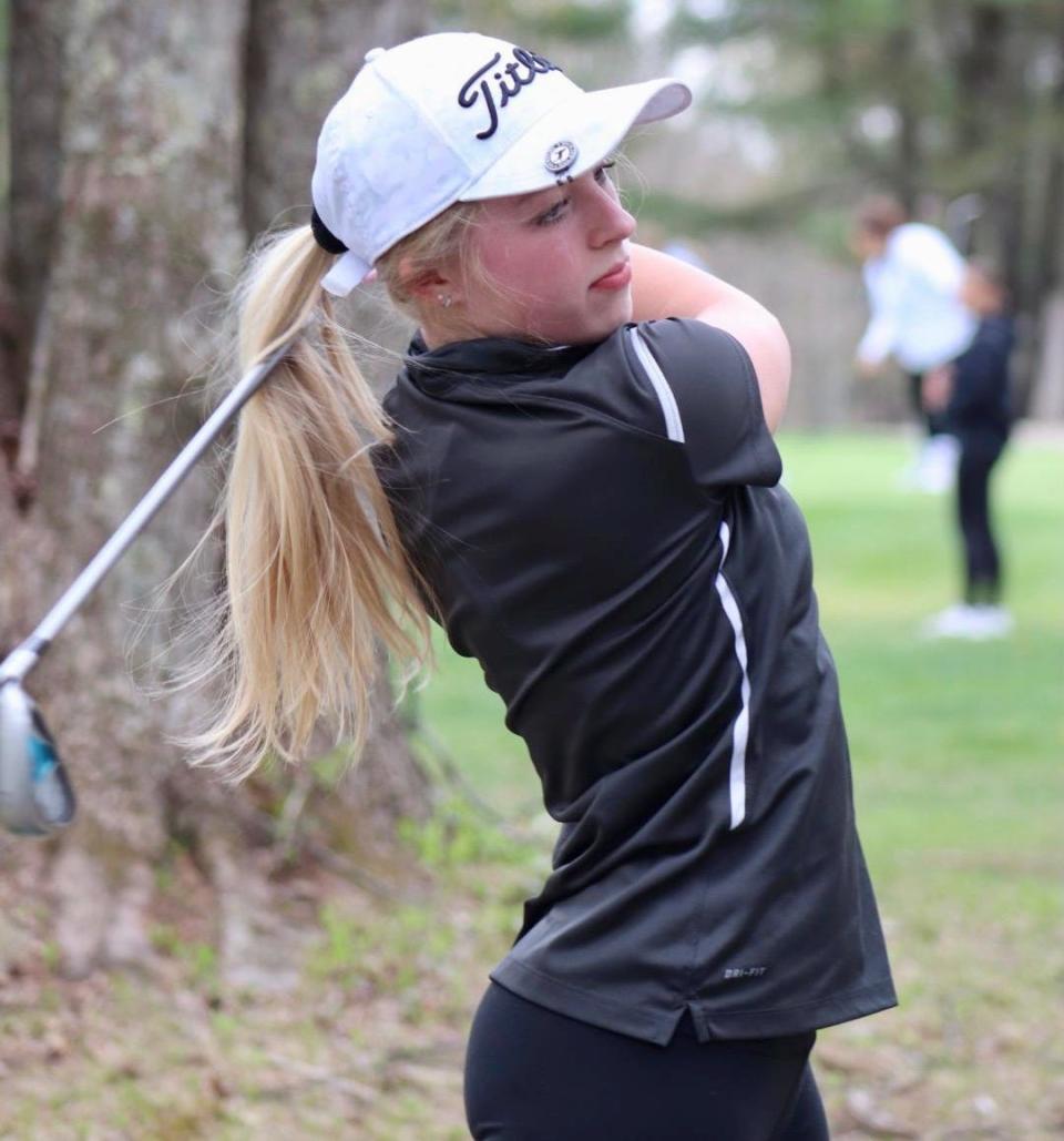 Auburn junior girls' golfer Cecilia Shenette takes a practice swing during a recent match at Bedrock Golf Club.