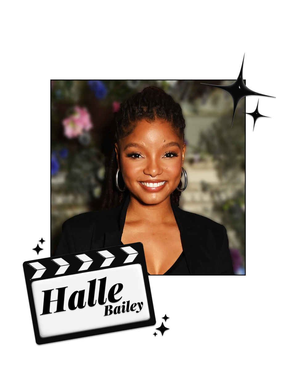 Halle Bailey in front of a gray wall