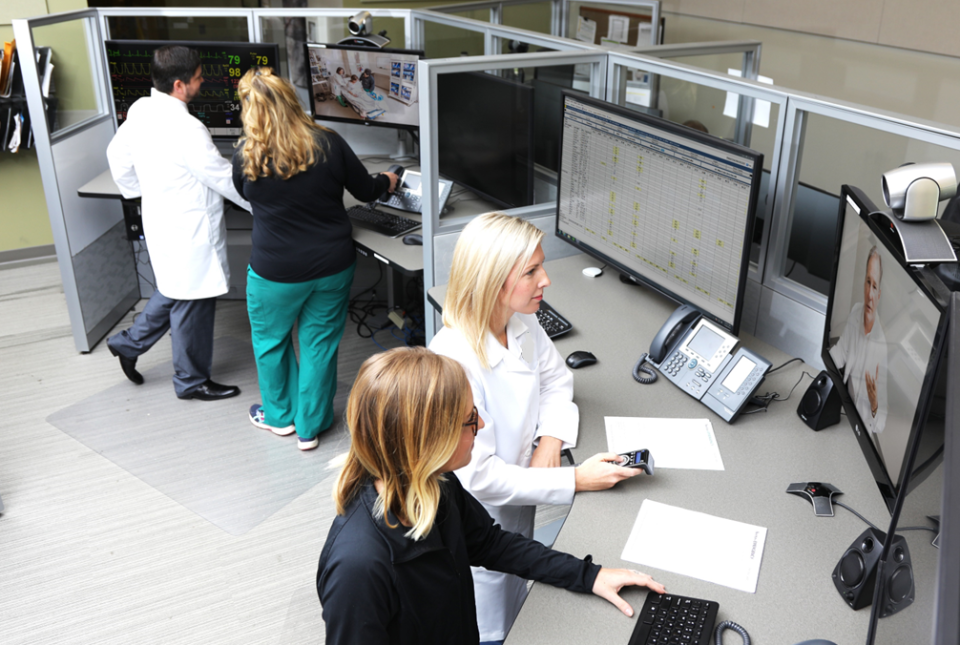 Doctors and nurses within the Avel eCare telemedicine hub in Sioux Falls, created and formerly owned by Avera Health, use technology to connect with emergency room personnel in other locations.