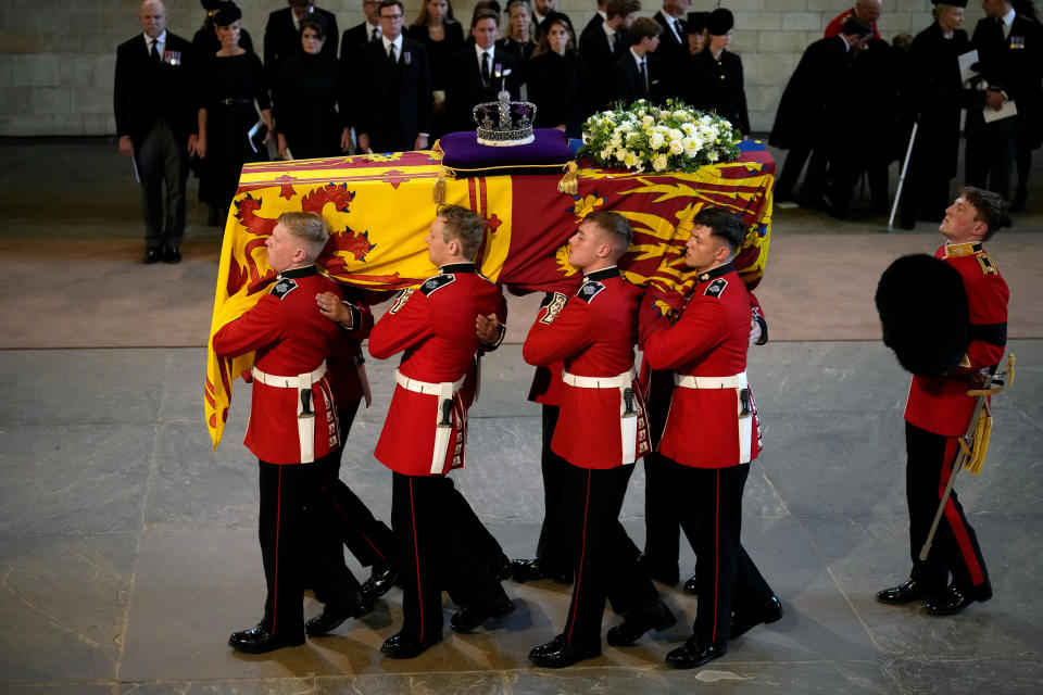 <p>LONDON, ENGLAND - SEPTEMBER 14: The Coffin of Queen Elizabeth II is carried into The Palace of Westminster during the procession for the Lying-in State of Queen Elizabeth II on September 14, 2022 in London, England. Christopher Furlong/Pool via REUTERS</p> 