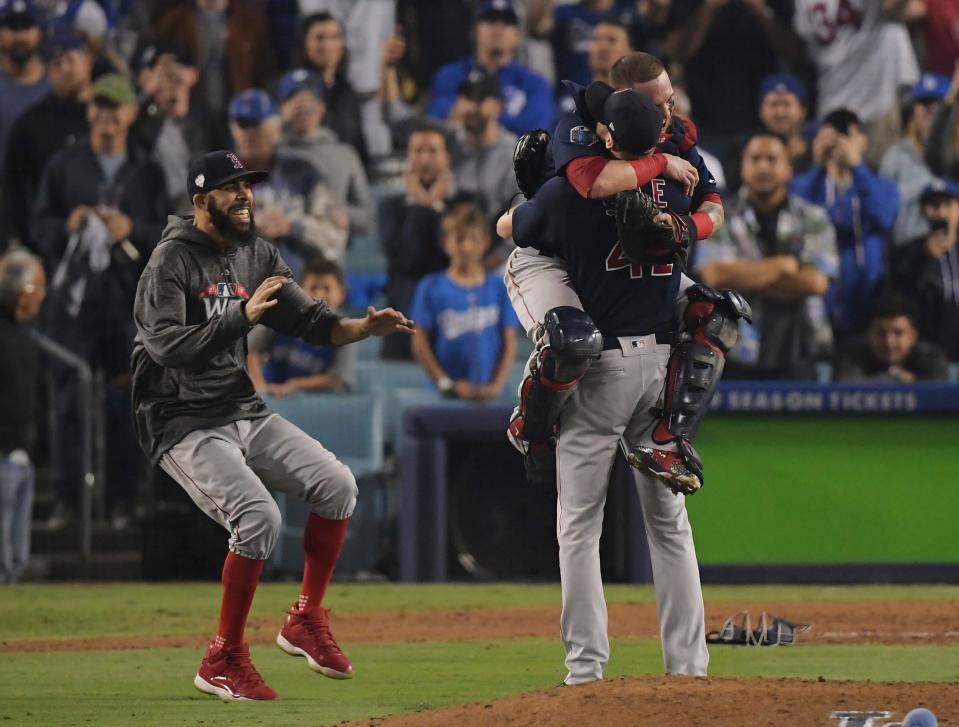 Boston's David Price, left, catcher Christian Vazquez and Chris Sale celebrate after Game 5 of the 2018 World Series against the Los Angeles Dodgers in Los Angeles. The Red Sox won, 5-1, to capture the championship.