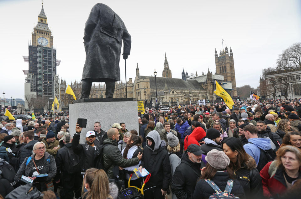 Demonstrators protesting Covid restrictions block Parliament Square in London on Dec. 18, 2021. (Martin Pope / Getty Images)