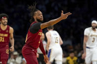 Cleveland Cavaliers guard Darius Garland (10) reacts after making a 3-point basket during the first half of an NBA basketball game against the Los Angeles Lakers, Saturday, April 6, 2024, in Los Angeles. (AP Photo/William Liang)