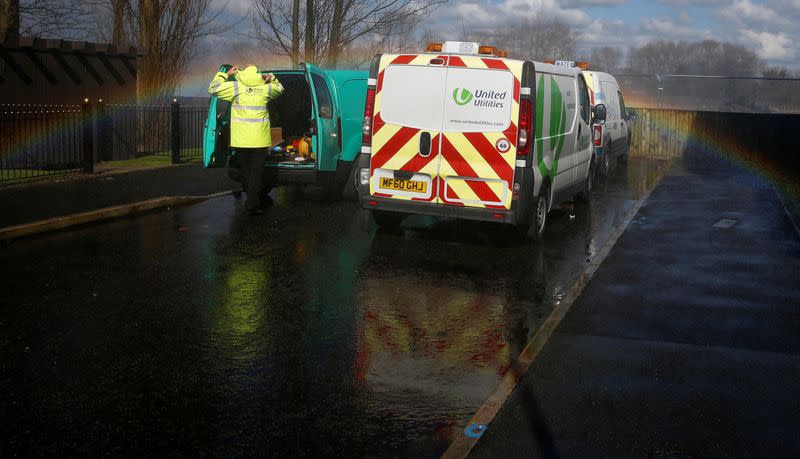 FILE PHOTO: A United Utilities engineer arrives at the scene of a burst water main