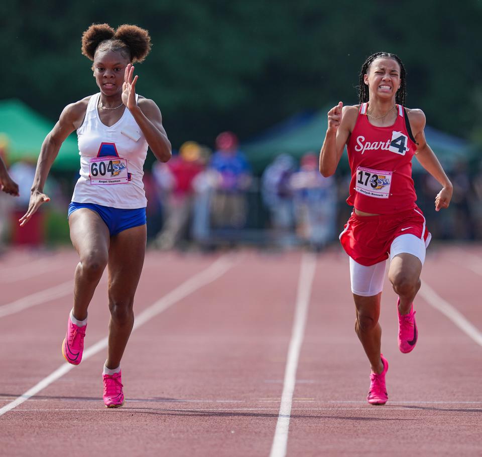 South Bend Adam's Angel Thomas (left) and Connersville's Ahniyah Bennett competes in the Saturday, June 3, 2023, during the IHSAA girls track and field state finals at Robert C. Haugh Track and Field Complex at Indiana University in Bloomington. 