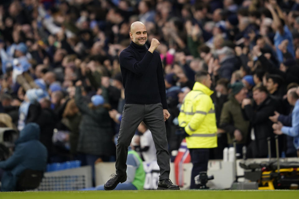 Manchester City's head coach Pep Guardiola celebrates after Manchester City's Phil Foden scores his side's second goal during an English Premier League soccer match between Manchester City and Manchester United at the Etihad Stadium in Manchester, England, Sunday, March 3, 2024. (AP Photo/Dave Thompson)