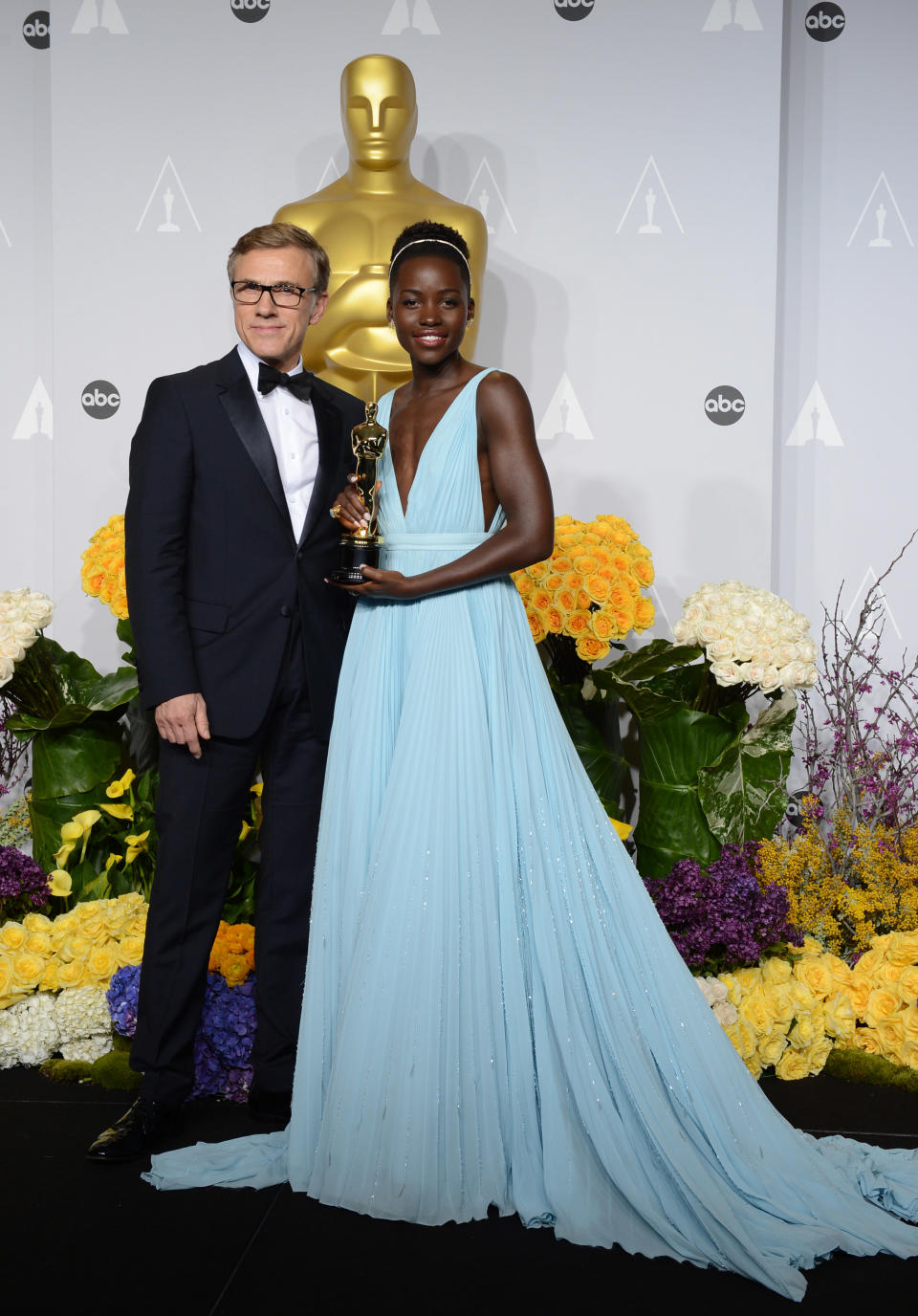 Christoph Waltz, left, and Lupita Nyong'o pose in the press room with her award for best actress in a supporting role for "12 Years a Slave" during the Oscars at the Dolby Theatre on Sunday, March 2, 2014, in Los Angeles. (Photo by Jordan Strauss/Invision/AP)