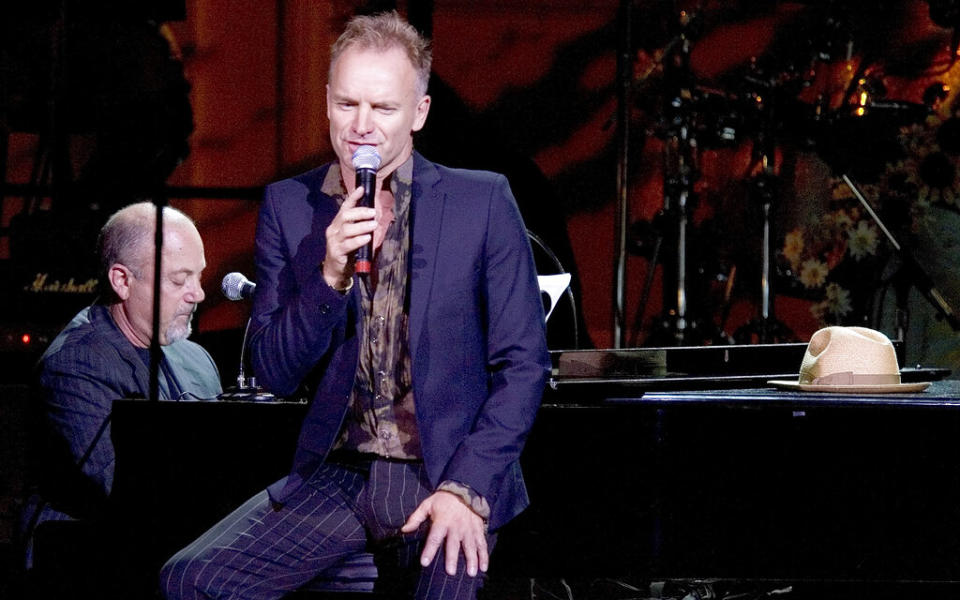 Sting sings as Billy Joel plays piano during the Rainforest Foundation Fund Benefit concert, Friday, May 19, 2006, at Carnegie Hall in New York. The Rainforest Fund, founded by Trudie Styler and husband Sting works to help indigenous peoples assert their rights and have their voices heard. (AP Photo/Stephen Chernin)