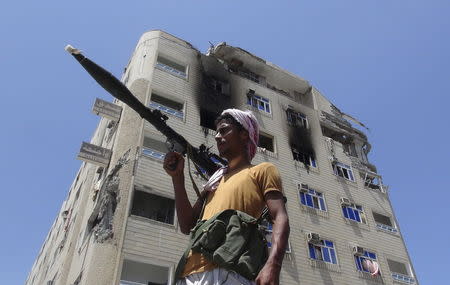 A Southern Popular Resistance fighter secures a street during fighting against Houthi fighters in the Dar Saad district of Yemen's southern port city of Aden May 9, 2015. REUTERS/Stringer